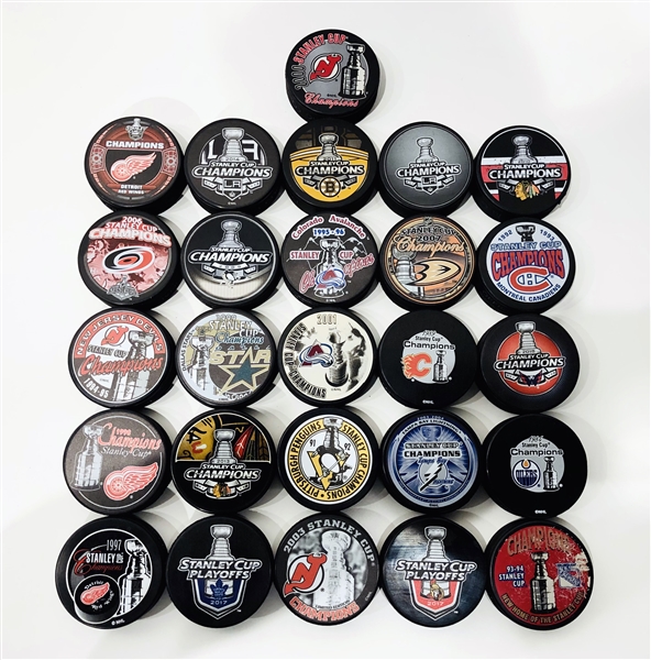 Lot of 26 Assorted Official NHL Stanley Cup Champions & Playoff Hockey Pucks