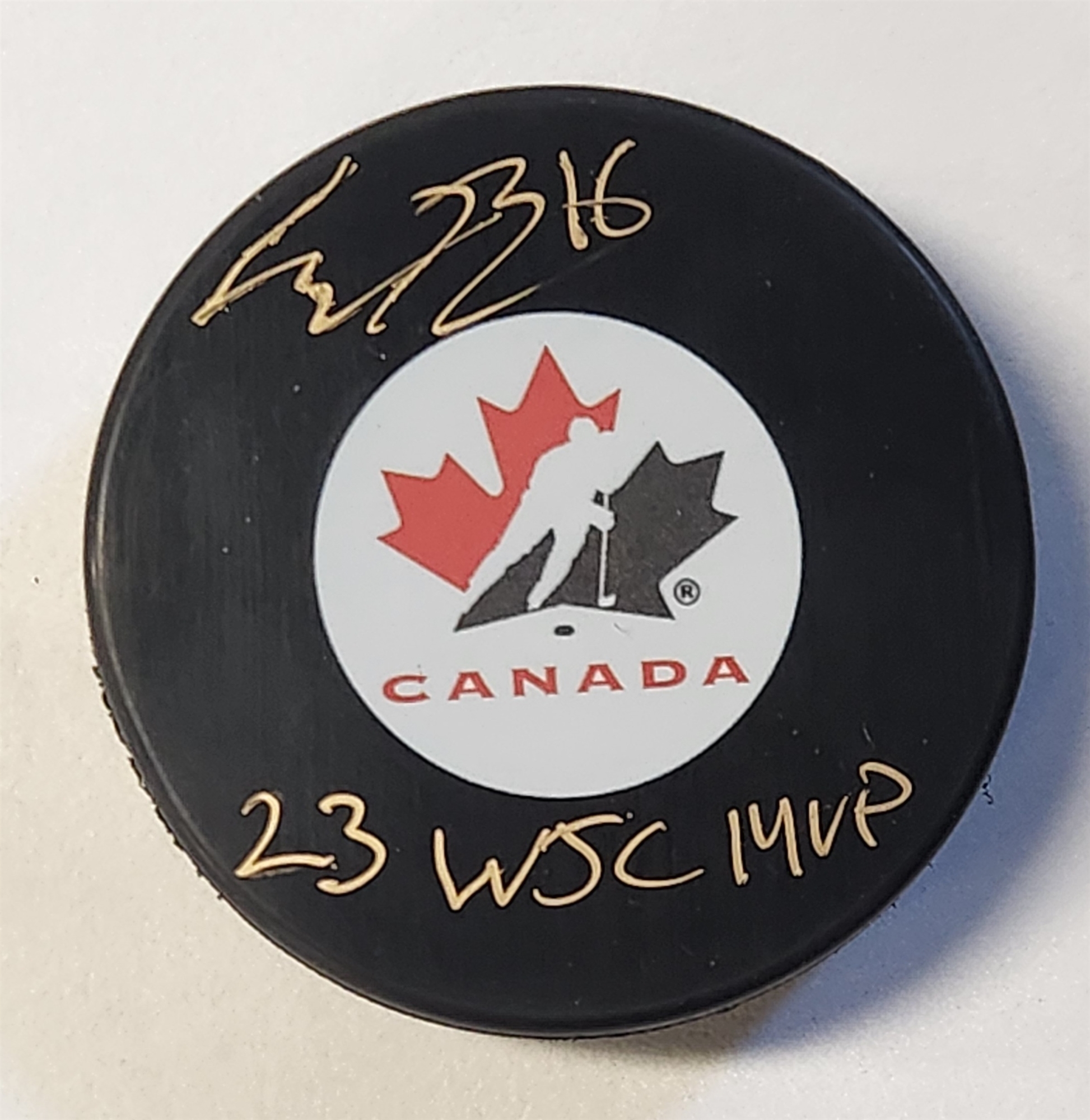 Connor Bedard Autographed Team Canada Hockey Puck with 23 WJC MVP