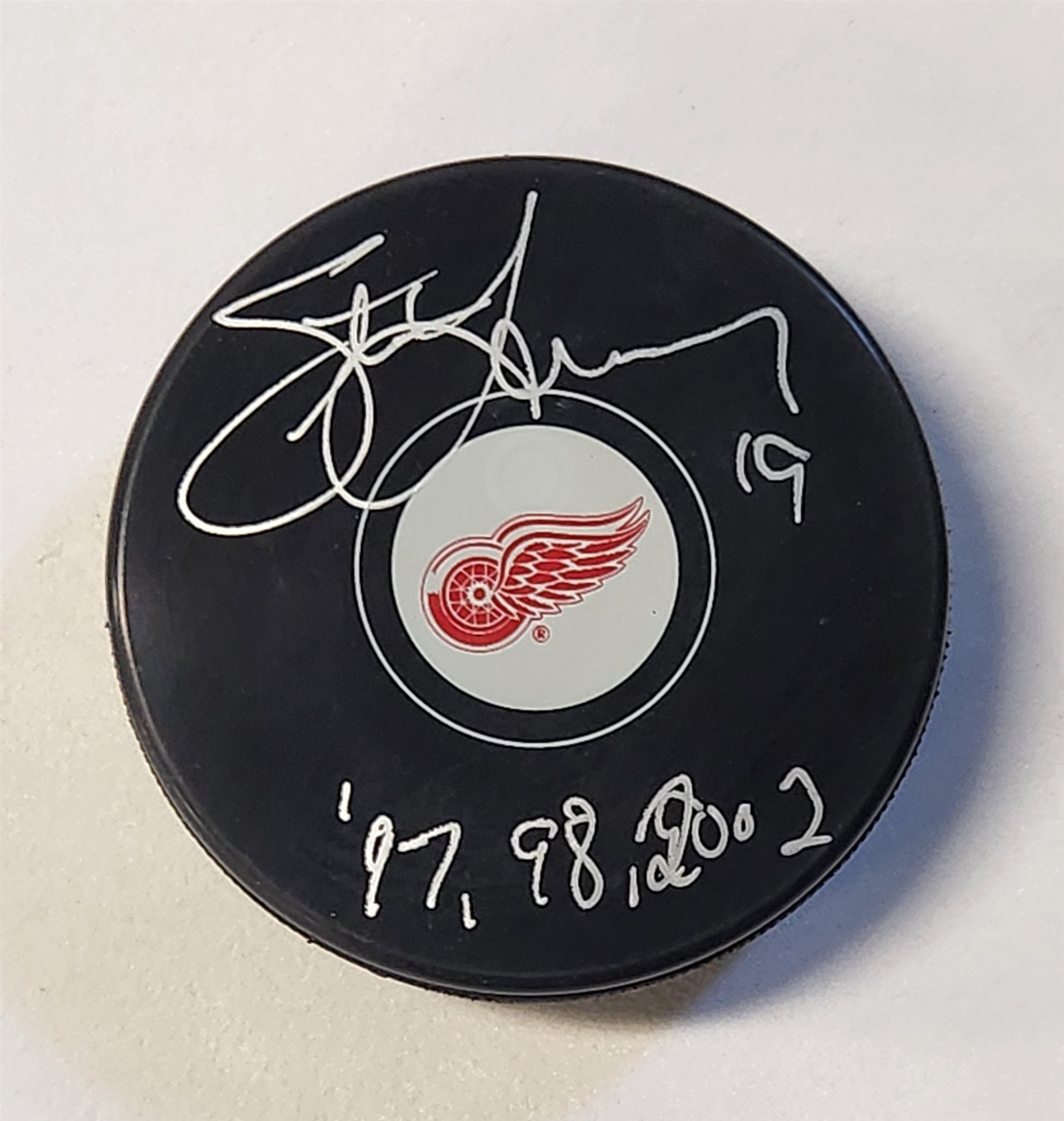 Steve Yzerman Autographed Detroit Red Wings Hockey Puck with Cup Notes (Flawed)